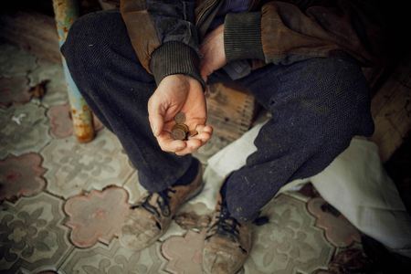 Male hand asks for money. The concept of poverty in the country.の写真素材