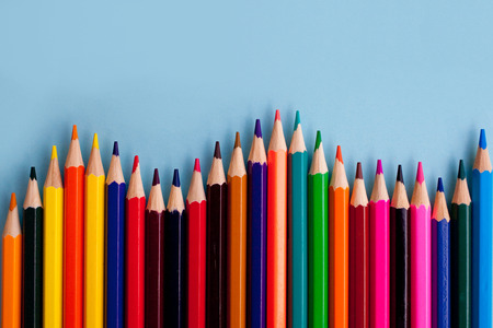 background from color pencils on blue paperの写真素材