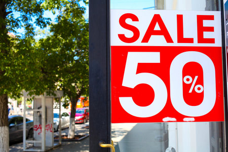 Sale 50% off mock up advertise display frame setting over the clothes line in the shopping...