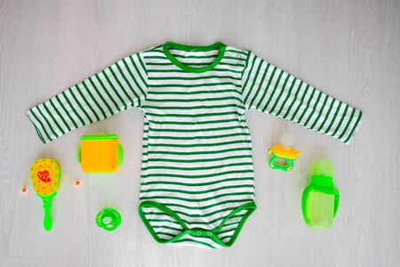 Children is clothing green color and accessories on the external backgroundの写真素材