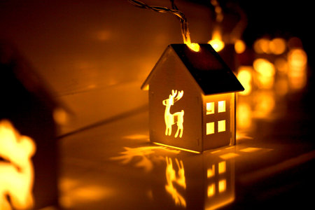 Christmas garland in the shape of a house with a picture of a deer. Copy space.の写真素材