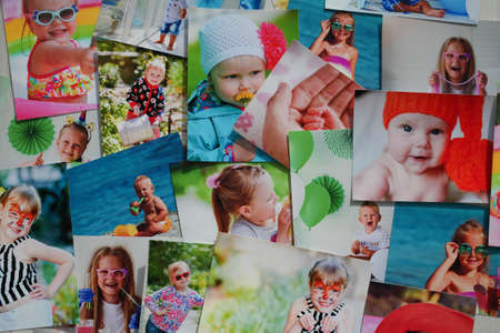 Printed photographs of children. A huge amount of printed materials.の写真素材