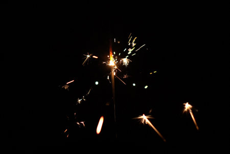 Glowing sparkle particles new year fountain glow and funky explosionの写真素材