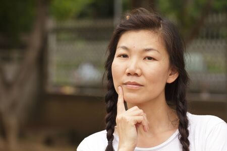 Portrait of a sexy young female smiling in a park - Outdoorの写真素材