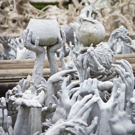 Series of Hands From Hell at Wat Rong Khun in Chiang Rai; Thailandの写真素材
