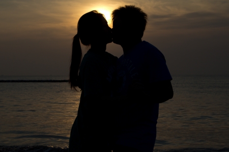 Black silhouette of a young girl in loveの写真素材