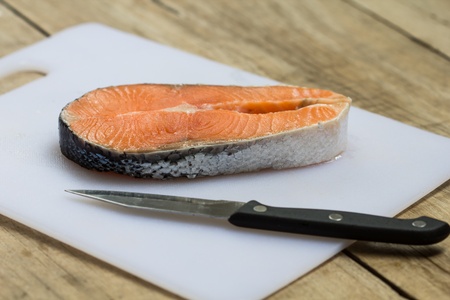 Salmon steak red fish on white backgroundの写真素材