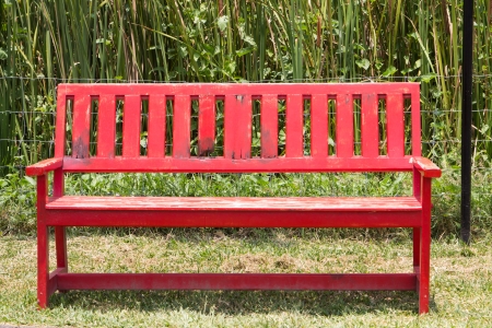 Red chairs located outdoors.の写真素材