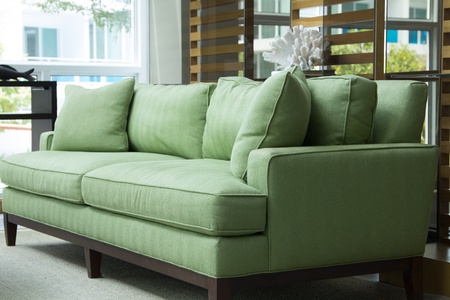 nice green sofa with pillowsの写真素材