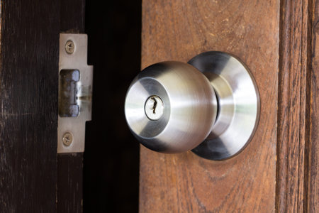 metal handle on a wooden doorの写真素材