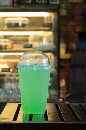 Kiwi Mix soda in plastic cups.の写真素材
