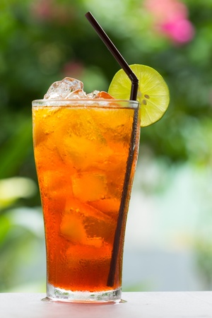 glass of ice tea with lemonの写真素材