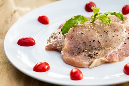 nice fresh meat, spices and greens on white backgroundの写真素材