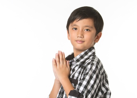 Sawasdee , A Thai boy paying respectの写真素材