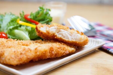 Fish dish - fried fish fillet with vegetablesの写真素材