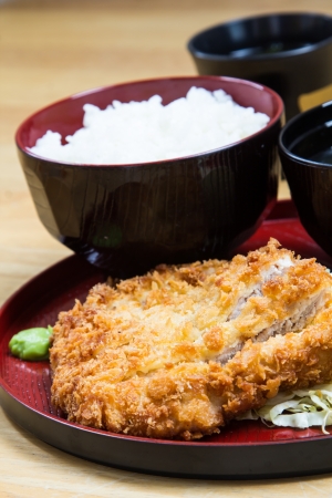 Fried breaded pork served with steamed rice and soup.の写真素材