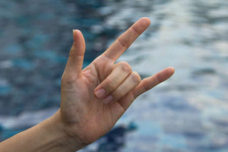 Symbol of woman hand on a pond.の写真素材