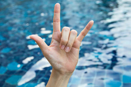 Symbol of woman hand on a pond.の写真素材