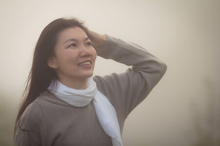Portrait of Asian woman in fog, in Doi Suthep nature parkのeditorial素材