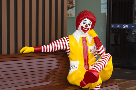 BANGKOK, THAILAND - APRIL 10 : Ronald McDonald character sitting on the bench at McDonald Restaurant on April 10, 2014 in Bangkok, Thailand. McDonald's Corporation is the world's largest burger fastfood restaurants.のeditorial素材