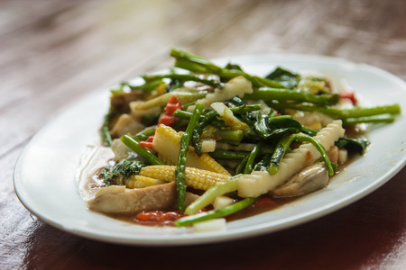 Stir-fried mix colorful vegetables and herbの写真素材