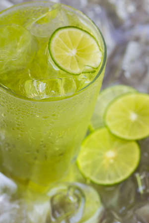 Lemon juice glass and fresh lemons.の写真素材