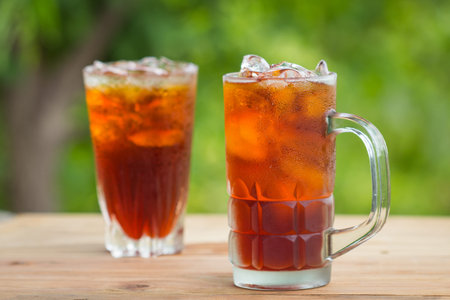 Glass of ice tea on a wooden table