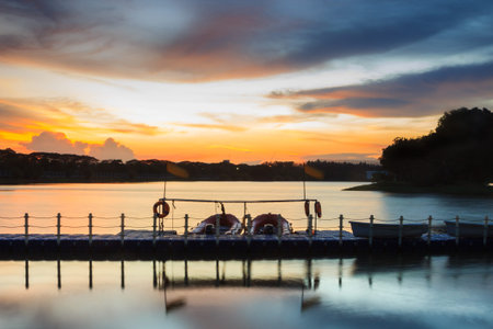 Small boat at the port in twilight time