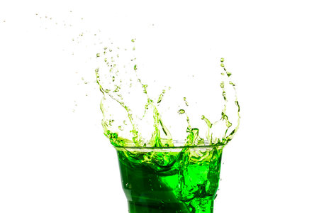 green liquid splash on white 