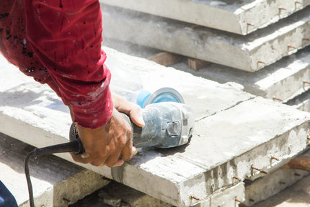 construction worker  cuting cement