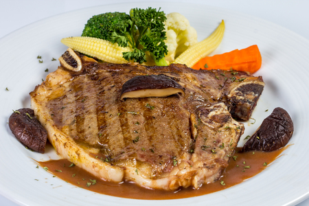 pork Steak with vegetable on the dishの写真素材