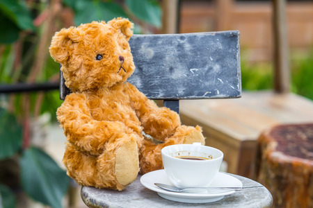 Teddy bear with a coffee in the morning.の写真素材
