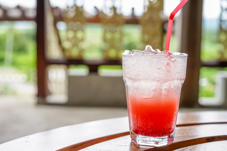 Strawberry cocktail on wooden table at coffee shopの写真素材