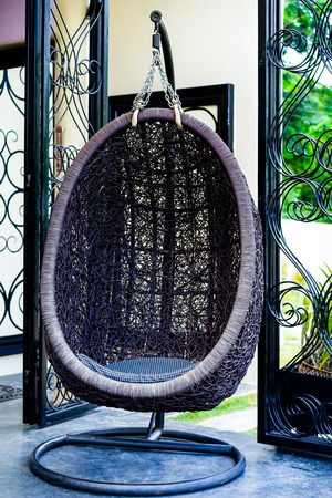 Vintage hanging chair on the garden.のeditorial素材