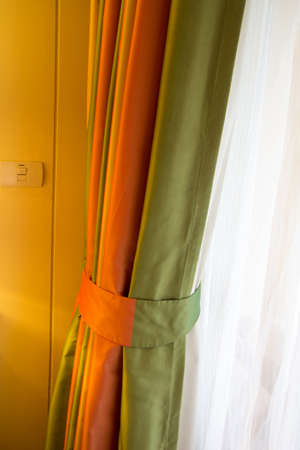 the curtain green and Orange in the bedroomの写真素材