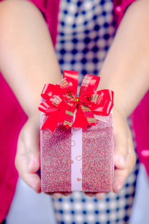 hand holding gift box for special day