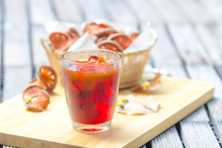 Bael juice in glass on wooden tableの写真素材