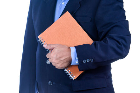 businessman holding a book on white backgroundの写真素材