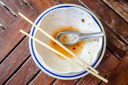 Empty bowl of noodles on wooden tableの写真素材