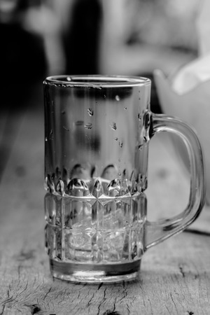 empty glass on wooden tableの写真素材