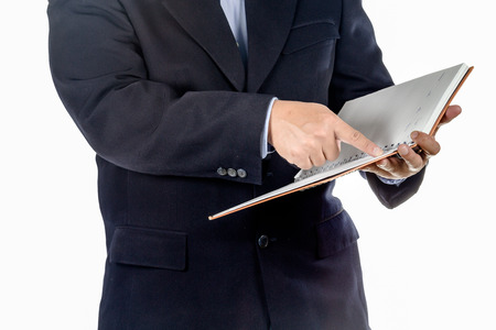 businessman writing in notebook on the deskの写真素材