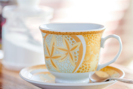 close up coffee cup on wooden table
