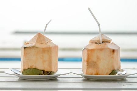coconut water drink on wooden tableの写真素材