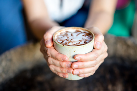 hand holding cup of coffeeの写真素材