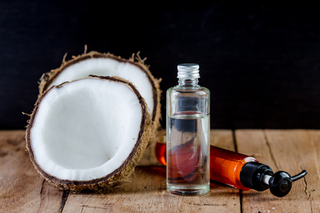 coconut, coconut oil, ginger oil for natural spa on woodenの写真素材