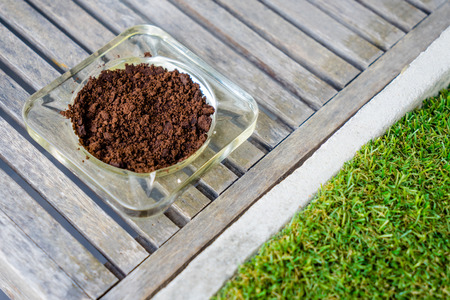 ashtray on table with glassの写真素材
