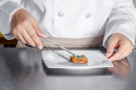 chef making bread with minced pork spreadの写真素材