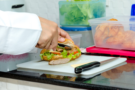 chef making croissant with gill pork, vegetable and cheeseの写真素材