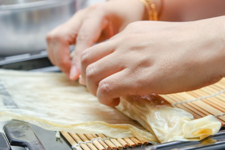 chef making deep fried crab meat roll chinese style food.