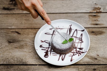 Dark chocolate lava cake in plateの写真素材